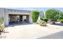 Charming single-story home with a two-car carport and well-maintained desert landscaping at 609 E Royal Palm S Sq, Phoenix, AZ 85020