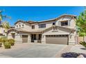 Stunning two-story home featuring a three-car garage and well-maintained landscaping at 614 E Benrich Dr, Gilbert, AZ 85295