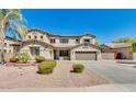Charming home with a well-manicured lawn and inviting curb appeal at 614 E Benrich Dr, Gilbert, AZ 85295