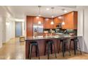 Modern kitchen with stainless steel appliances, sleek countertops, and breakfast bar at 7161 E Rancho Vista Dr # 1013, Scottsdale, AZ 85251