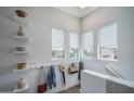 Bright hallway with natural light and stylish decor in the modern townhouse at 14870 W Encanto Blvd # 2123, Goodyear, AZ 85395