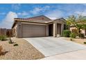 Single-story home featuring low-maintenance desert landscaping, and a two-car garage at 17532 W Copper Ridge Dr, Goodyear, AZ 85338