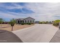 Beautiful single-story home featuring desert landscaping and a long concrete driveway leading to the residence at 19029 E Mary Ann Way, Queen Creek, AZ 85142