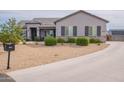 Attractive single-story house with desert landscaping, grey trim, and shutters, plus a long driveway at 19029 E Mary Ann Way, Queen Creek, AZ 85142