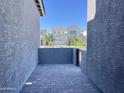 Private patio with gray brick floor provides a cozy outdoor space at 22709 E Saddle Way, Queen Creek, AZ 85142