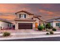 Beautiful home with desert landscaping, complemented by a brown garage door and warm exterior tones at 2607 W Gray Wolf Trl, Phoenix, AZ 85085