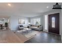 Bright living room boasts fresh paint, natural light, and contemporary decor at 405 E Stanford Ave, Gilbert, AZ 85234