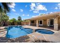 Inviting pool and spa with covered patio and desert landscaping at 4625 E Villa Maria Dr, Phoenix, AZ 85032