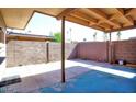 A spacious backyard patio with concrete paving and block wall fencing at 4625 W Thomas Rd # 71, Phoenix, AZ 85031