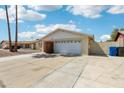 Charming single-story home featuring a two-car garage, brick accents and low-maintenance desert landscaping at 638 W Pantera Ave, Mesa, AZ 85210