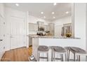 Charming kitchen with granite countertops, stainless steel appliances, and seating area at 14575 W Mountain View Blvd # 11308, Surprise, AZ 85374