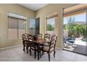 Charming dining room with a wooden table and chairs, and sliding glass doors to the backyard at 15608 E Chaparral Way, Fountain Hills, AZ 85268