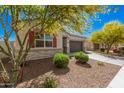 Lovely single-Gathering home featuring a two-car garage, easy-care yard, and classic architectural details at 235 S 190Th Ave, Buckeye, AZ 85326