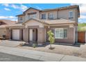 Charming two-story home featuring a three-car garage and a well-maintained, xeriscaped front yard for low maintenance at 2831 W Margy Ct, Phoenix, AZ 85017