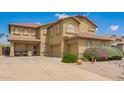 Attractive home with three-car garage, desert landscaping, and a spacious driveway at 30013 N Candlewood Dr, San Tan Valley, AZ 85143