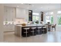 Spacious kitchen featuring a large island and barstool seating at 3145 E Boot Track Trl, Gilbert, AZ 85296