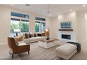 Bright living room with modern decor, stylish furniture, and an open floor plan at 3145 E Boot Track Trl, Gilbert, AZ 85296