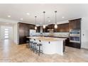 Modern kitchen with a large island, stainless steel appliances, and ample cabinet space at 3394 E Tiffany Ct, Gilbert, AZ 85298