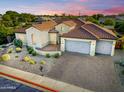 Expansive aerial view of a single-story home with a terracotta roof and a brick driveway at 3753 E Ellis St, Mesa, AZ 85205