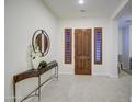 Inviting home entryway showcasing a decorative mirror and console table, creating a warm welcome at 3753 E Ellis St, Mesa, AZ 85205