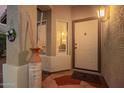 Inviting front entrance featuring a stone-tiled porch and decorative porch decor at 3971 E Heather Ct, Gilbert, AZ 85234
