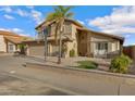 Attractive two-story home featuring manicured desert landscaping, a three-car garage, and stylish facade at 4019 W Charlotte Dr, Glendale, AZ 85310