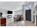Bright, airy living room with neutral colors, recessed lights, large windows, and tile flooring at 4019 W Charlotte Dr, Glendale, AZ 85310