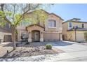 Charming two-story home featuring a spacious driveway, covered porch, and low-maintenance front yard at 45543 W Guilder Ave, Maricopa, AZ 85139