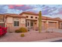 Charming home featuring desert landscaping, stone accents, a tile roof, and a well-manicured front yard at 4615 S Primrose Dr, Gold Canyon, AZ 85118