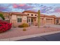 Charming home featuring desert landscaping, stone accents, a tile roof, and a well-manicured front yard at 4615 S Primrose Dr, Gold Canyon, AZ 85118
