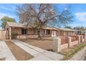 Charming single-story home with well-maintained front yard and attached garage in a quiet neighborhood at 5137 N 20Th Ave, Phoenix, AZ 85015