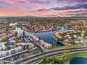 Scenic aerial view of a lakeside community, highlighting the waterfront properties and lush landscaping at 780 S Lagoon Dr, Gilbert, AZ 85233