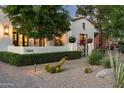 Beautiful home exterior featuring well-manicured desert landscaping and a welcoming walkway at 7902 E Via Linda --, Scottsdale, AZ 85258