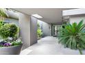 Welcoming entryway showcasing a modern design with plants, sunlight, and decorative tiles at 9829 N 49Th Pl, Paradise Valley, AZ 85253