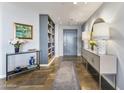 Contemporary condo foyer with neutral walls, tile floors, and decorative lighting fixtures at 1040 E Osborn Rd # 1103, Phoenix, AZ 85014