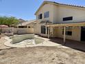 A pool and covered patio provide outdoor living and entertaining, next to the home's exterior at 11001 Clear Water --, Goodyear, AZ 85338
