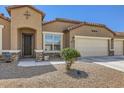 Welcoming front entrance with decorative security door and low maintenance desert landscaping at 13811 W Paso Trl, Peoria, AZ 85383