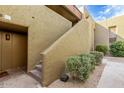 Building exterior with stairs leading up to a unit at 1701 W Tuckey Ln # 231, Phoenix, AZ 85015