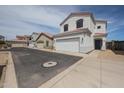 Exterior shot of homes in a residential neighborhood with well-maintained landscaping and driveways at 1750 W Union Hills Dr # 8, Phoenix, AZ 85027