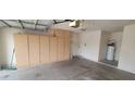 Spacious garage with built-in storage cabinets and room for parking at 1835 E Cortez Dr, Gilbert, AZ 85234