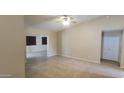 Open living room with tile flooring and neutral paint, with easy access to other spaces at 1835 E Cortez Dr, Gilbert, AZ 85234