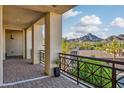 Enjoy stunning mountain views from this spacious balcony with decorative iron railings at 2 Biltmore Est # 309, Phoenix, AZ 85016