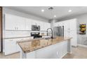 Bright kitchen featuring granite countertops, a subway tile backsplash, and stainless steel appliances at 21288 E Via Del Sol --, Queen Creek, AZ 85142