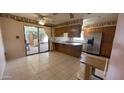 Well-equipped kitchen with a view to an outdoor patio for easy dining and entertaining at 2137 W Del Campo Cir, Mesa, AZ 85202