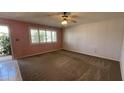 Spacious living room featuring a large window allowing for plenty of natural light at 2137 W Del Campo Cir, Mesa, AZ 85202