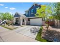 Charming two-story home with a spacious driveway and a well-maintained front yard at 23451 S 228Th St, Queen Creek, AZ 85142