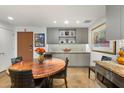 Cozy dining area features a unique round table, modern cabinetry, and stylish decor at 2300 E Campbell Ave # 104, Phoenix, AZ 85016