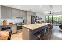 Bright, modern kitchen features stainless steel appliances and a large island with bar seating at 2300 E Campbell Ave # 104, Phoenix, AZ 85016
