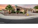 Well-maintained home featuring a desert landscape, two-car garage, and beautiful curb appeal at 3256 E Maplewood St, Gilbert, AZ 85297