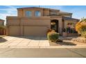Stunning two-story home featuring a three-car garage and beautifully landscaped front yard at 3830 N Red Sky Cir, Mesa, AZ 85207